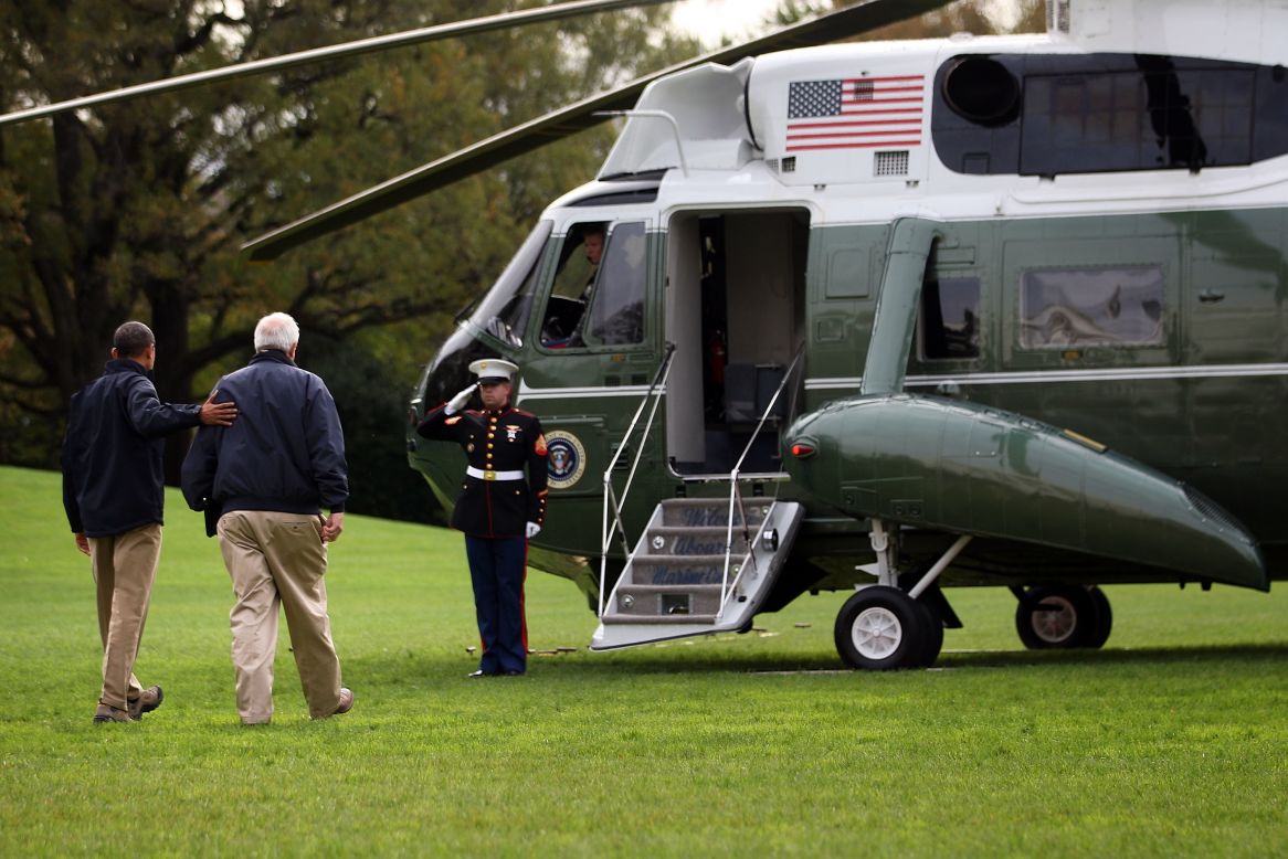 President Obama walks towards Marine One with FEMA Administrator Craig Fugate prior to his departure from the White House for a tour around storm-damaged areas of New Jersey.
