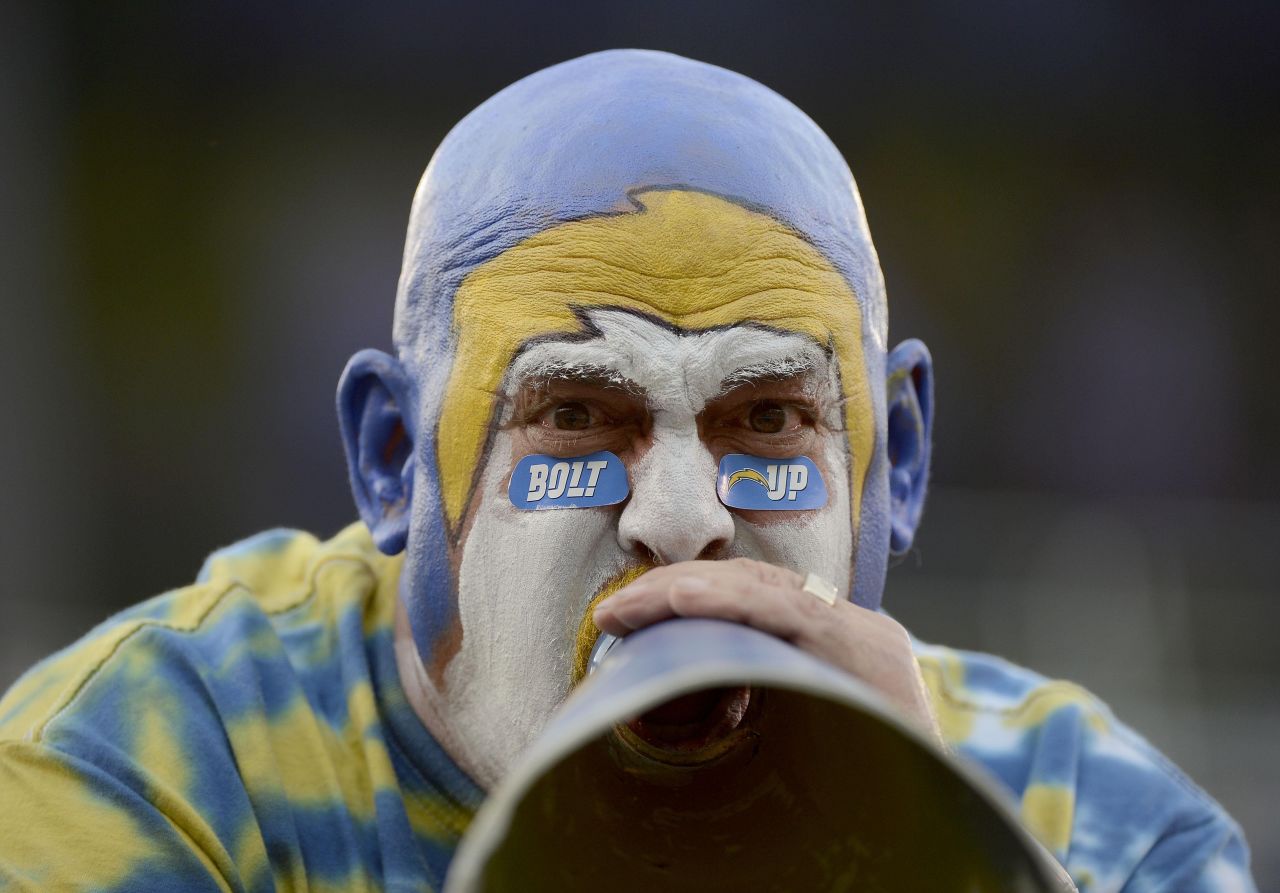 A Chargers fan cheers during the game on Thursday.