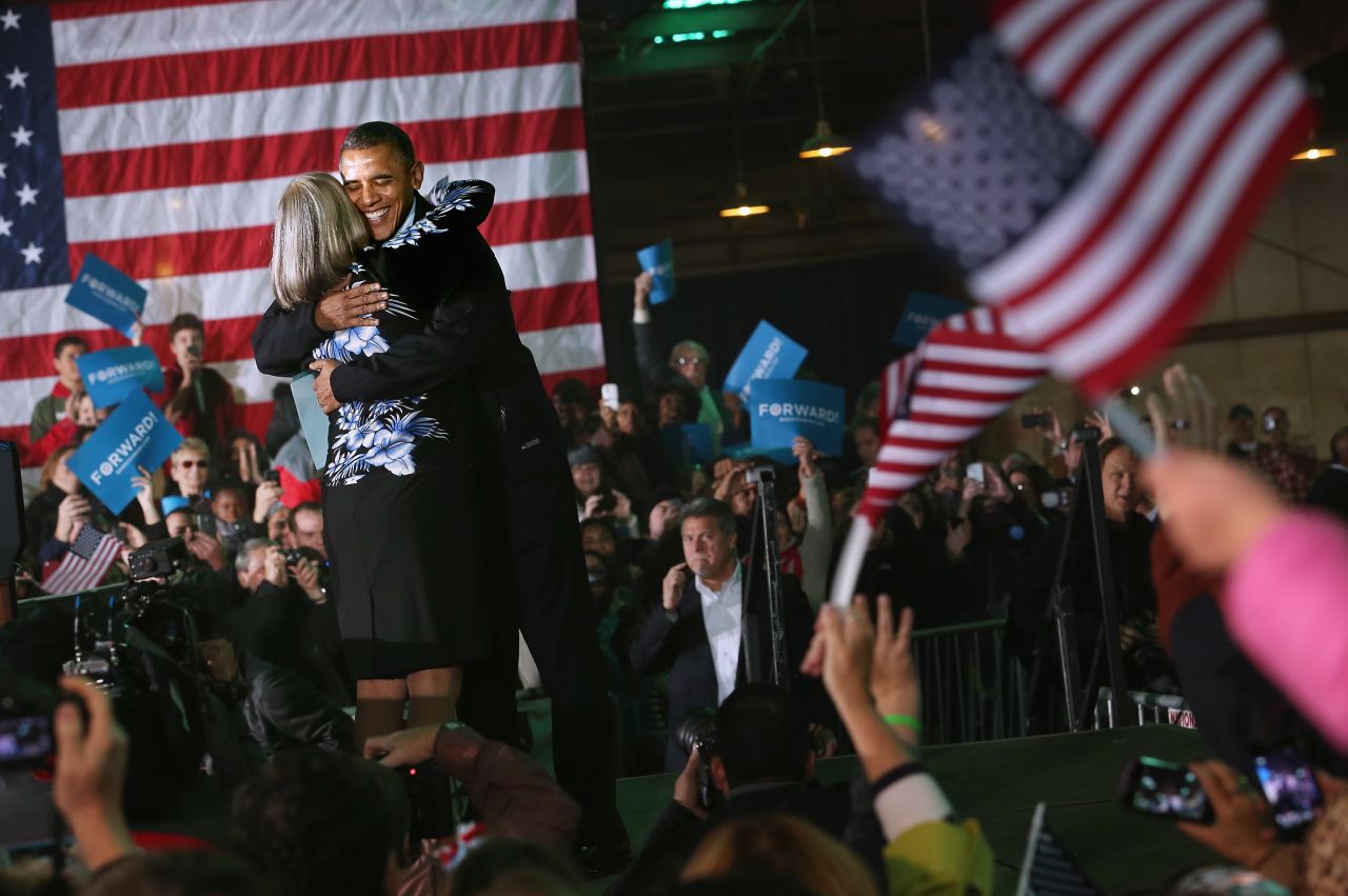 President Barack Obama embraces Judith Kamalay after she introduced him during a campaign rally Friday, November 2, in Hilliard, Ohio.
