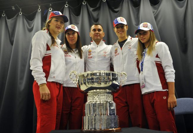 Serbia's Bojana Jovanovski, Jelena Jankovic, captain Dejan Vranes, Ana Ivanovic and Aleksandra Krunic pose for a photo with the trophy ahead of the weekend's battle with the Czech Republic.