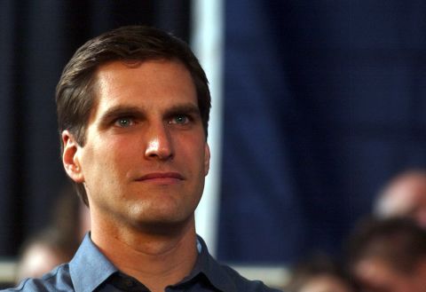 Mitt Romney's son Josh listens to his dad speak at a rally in Des Moines, Iowa, in 2007.