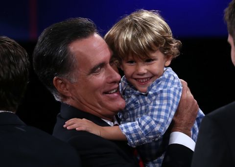 Mitt Romney holds his grandson Miles Romney at the conclusion of the final debate in 2012.