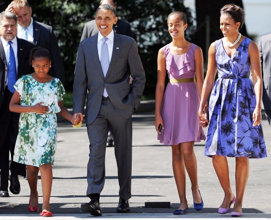 U.S. President Barack Obama walks to church with his wife, first lady Michelle Obama, and their daughters Sasha, left, and Malia, right in 2011.