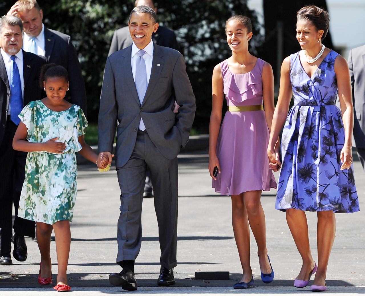 U.S. President Barack Obama walks to church with his wife, first lady Michelle Obama, and their daughters Sasha, left, and Malia, right in 2011.