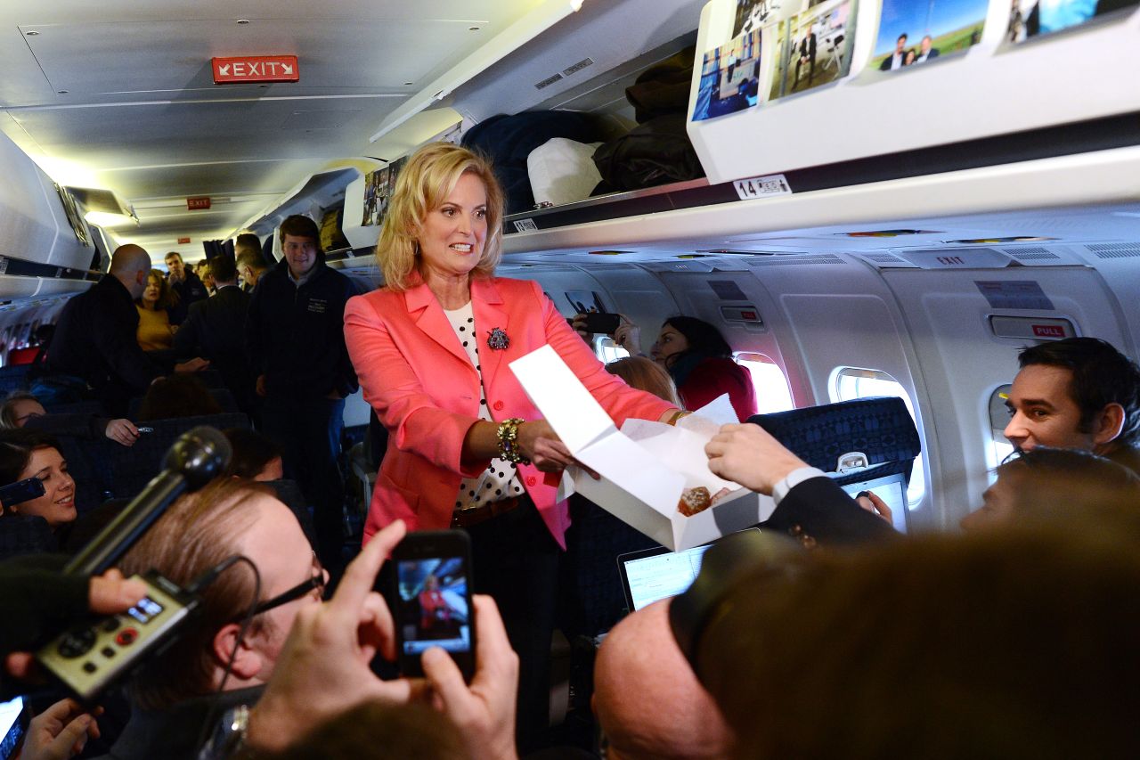 Ann Romney offers pastries to journalists aboard GOP presidential candidate Mitt Romney's campaign plane at Portsmouth International Airport in Newington, New Hampshire, on Saturday.