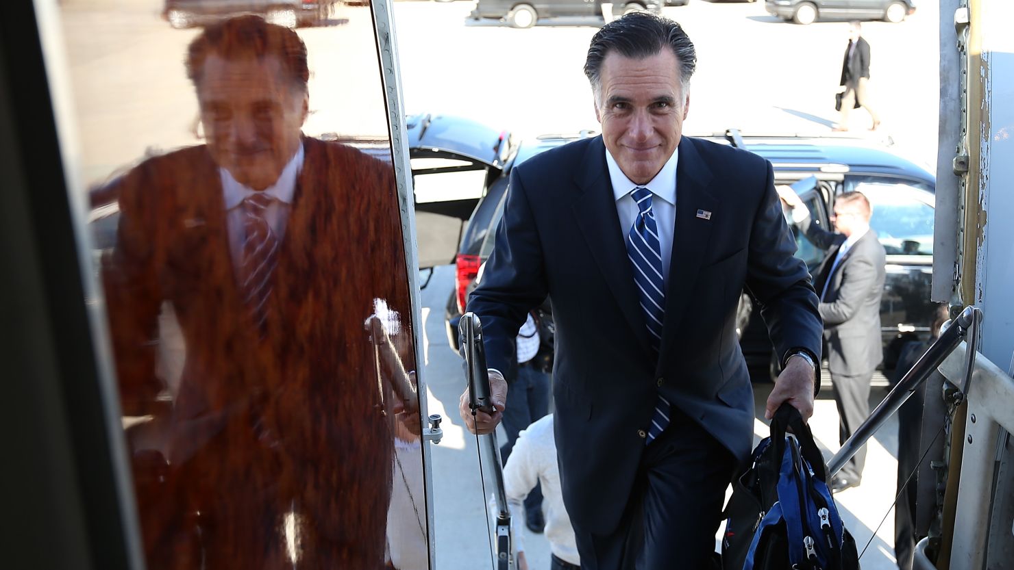  Republican presidential candidate Mitt Romney boards his campaign plane on November 2 in Milwaukee.