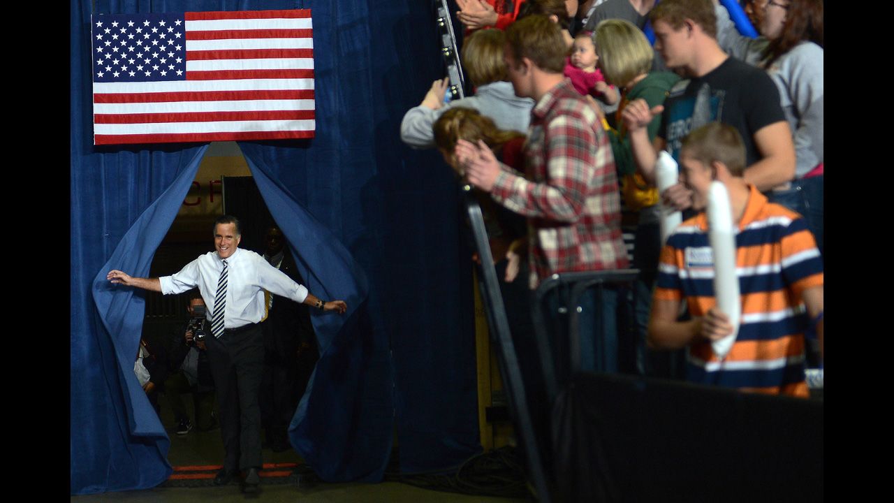 Romney arrives at Sunday's rally in Des Moines.