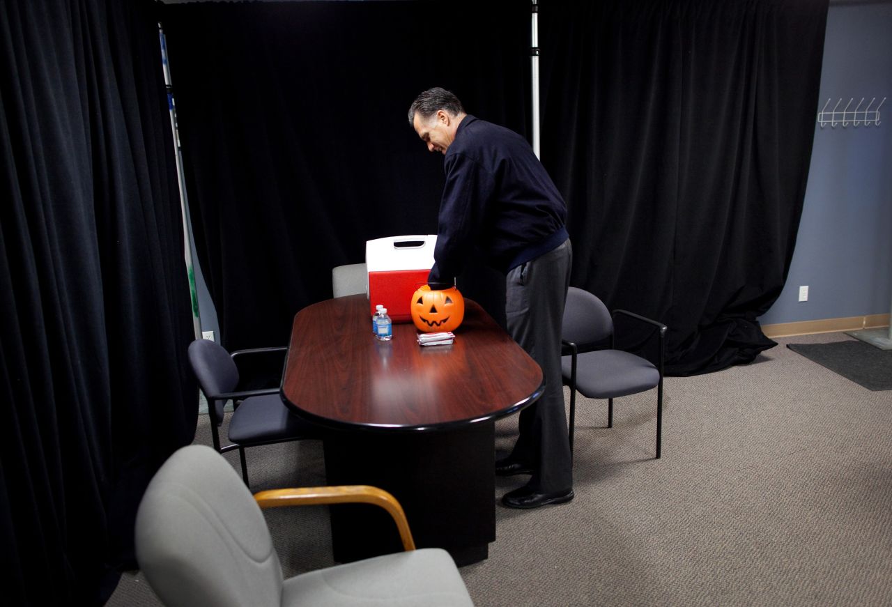 Romney grabs Halloween candy backstage before speaking in Ames, Iowa, on Oct. 26, 2012. 