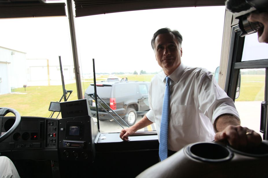 Romney stands at the front of his campaign bus in Kissimmee, Florida, on Oct. 27, 2012. 