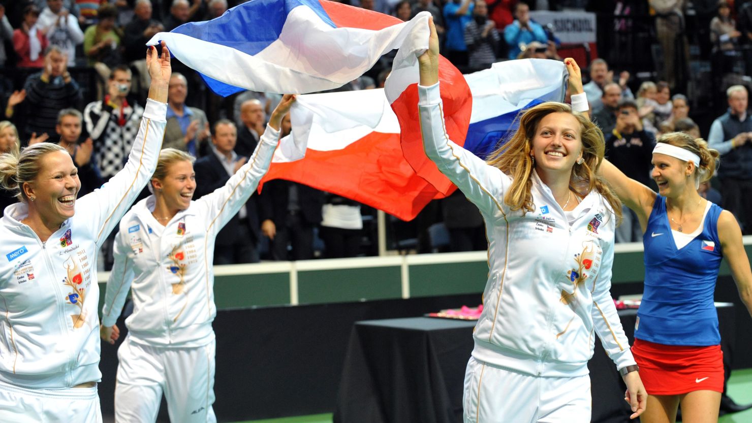 Czech Fed Cup members (from left) Lucie Hradecka, Andrea Hlavackova, Petra Kvitova and Lucie Safarova celebrate Sunday's victory on their home courts in Prague.