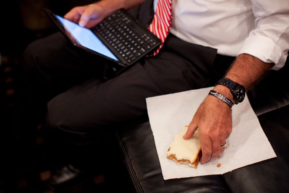 Romney eats a peanut butter and jelly sandwich while working on a speech aboard his campaign bus in Doswell, Virginia, on Nov. 1, 2012.