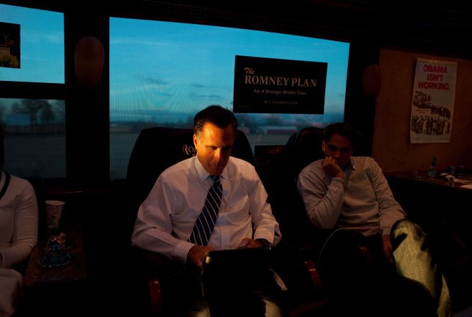 Romney and son, Craig, read aboard their campaign bus in Etna, Ohio, on Nov. 2, 2012.