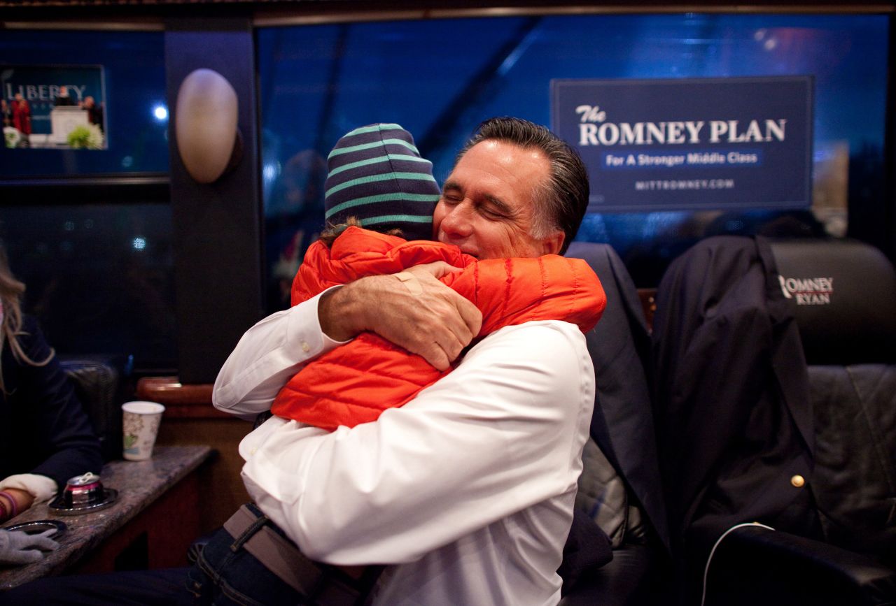 Romney hugs his grandson, Parker, inside his campaign bus after arriving in West Chester, Ohio, on Nov. 2, 2012. 
