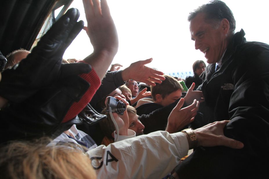 Romney greets supporters at an airport rally in Dubuque, Iowa, on Nov. 2, 2012.