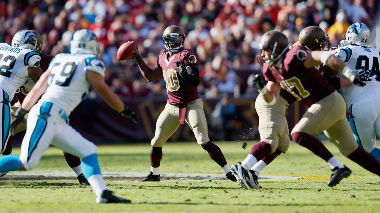 Quarterback Robert Griffin III of the Redskins throws a second quarter pass against the Panthers on Sunday.