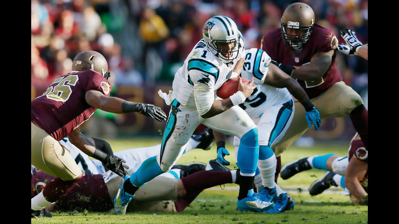 Quarterback Cam Newton of the Panthers rushes the ball against the Redskins during the second quarter on Sunday.