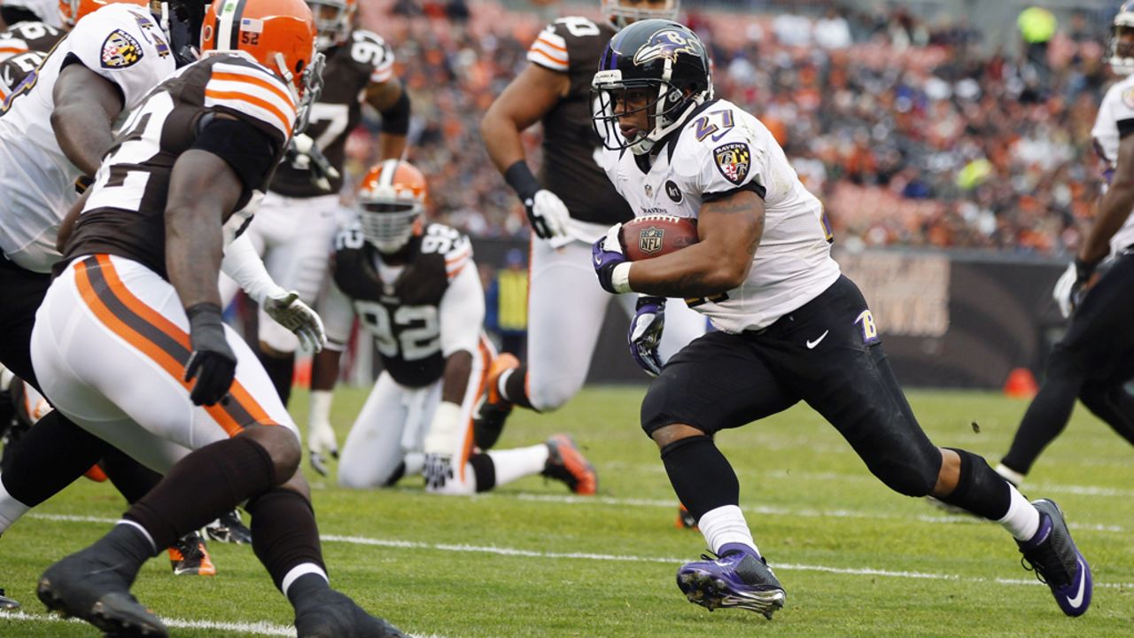 Running back Ray Rice of the Baltimore Ravens scores a touchdown in front of defensive back Buster Skrine of the Cleveland Browns at Cleveland Browns Stadium on Sunday in Ohio.