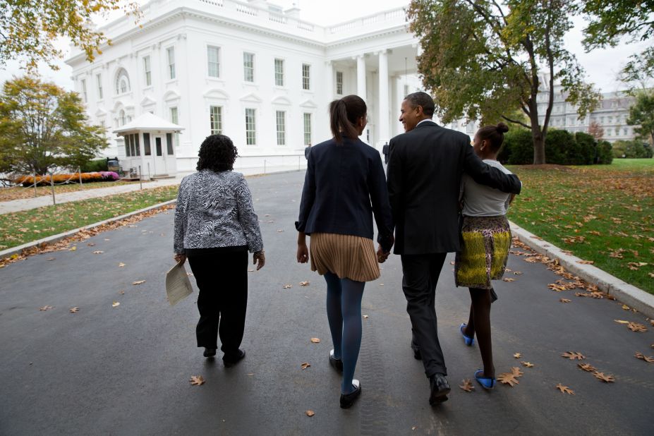 Obama walks with daughters Sasha, right, and Malia, center, and Kaye Wilson as they return to the White House from St. John's Episcopal Church in Washington on Oct. 28, 2012. 