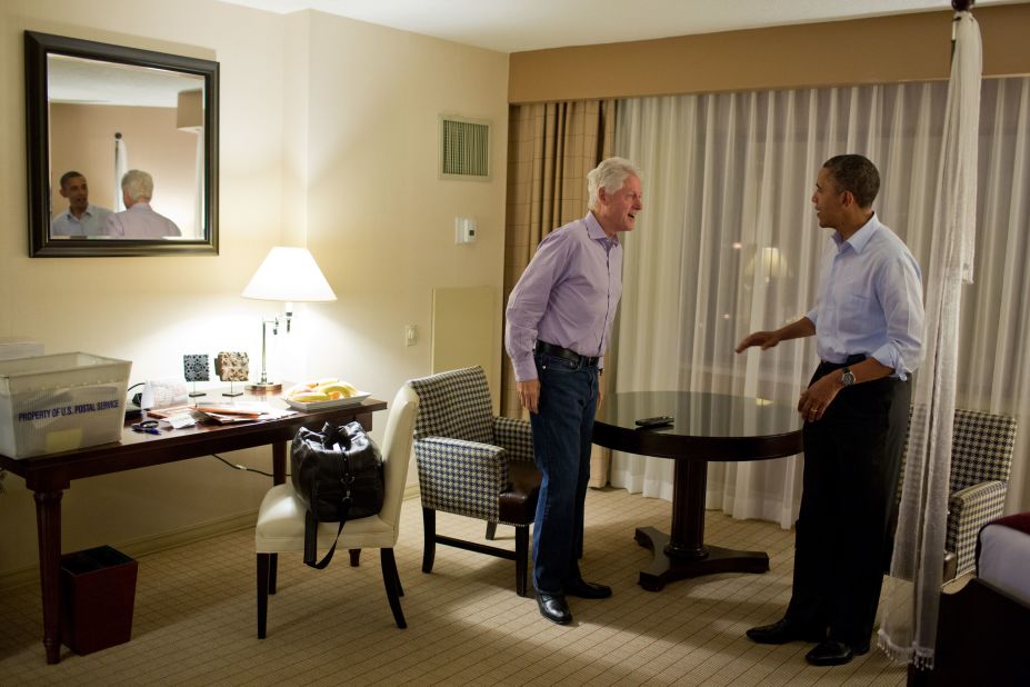 Obama talks with former President Bill Clinton at the DoubleTree Downtown Orlando Hotel in Orlando, Florida, on Oct. 28, 2012.