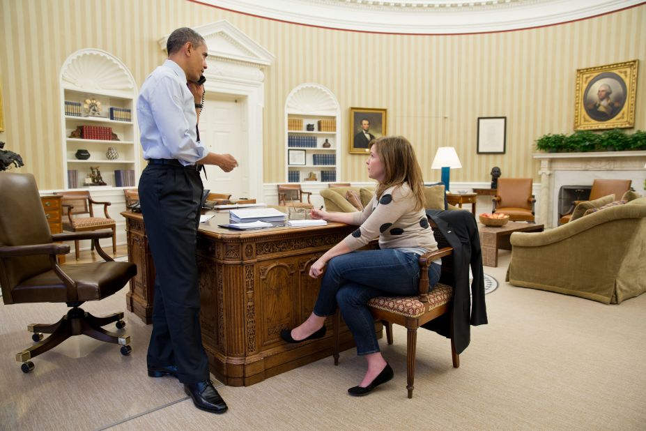 Obama discusses the response to Hurricane Sandy by phone with New Jersey Gov. Chris Christie, while Alyssa Mastromonaco, the Deputy White House Chief of Staff for Operations, sits at right in the Oval Office on Oct. 30, 2012. 