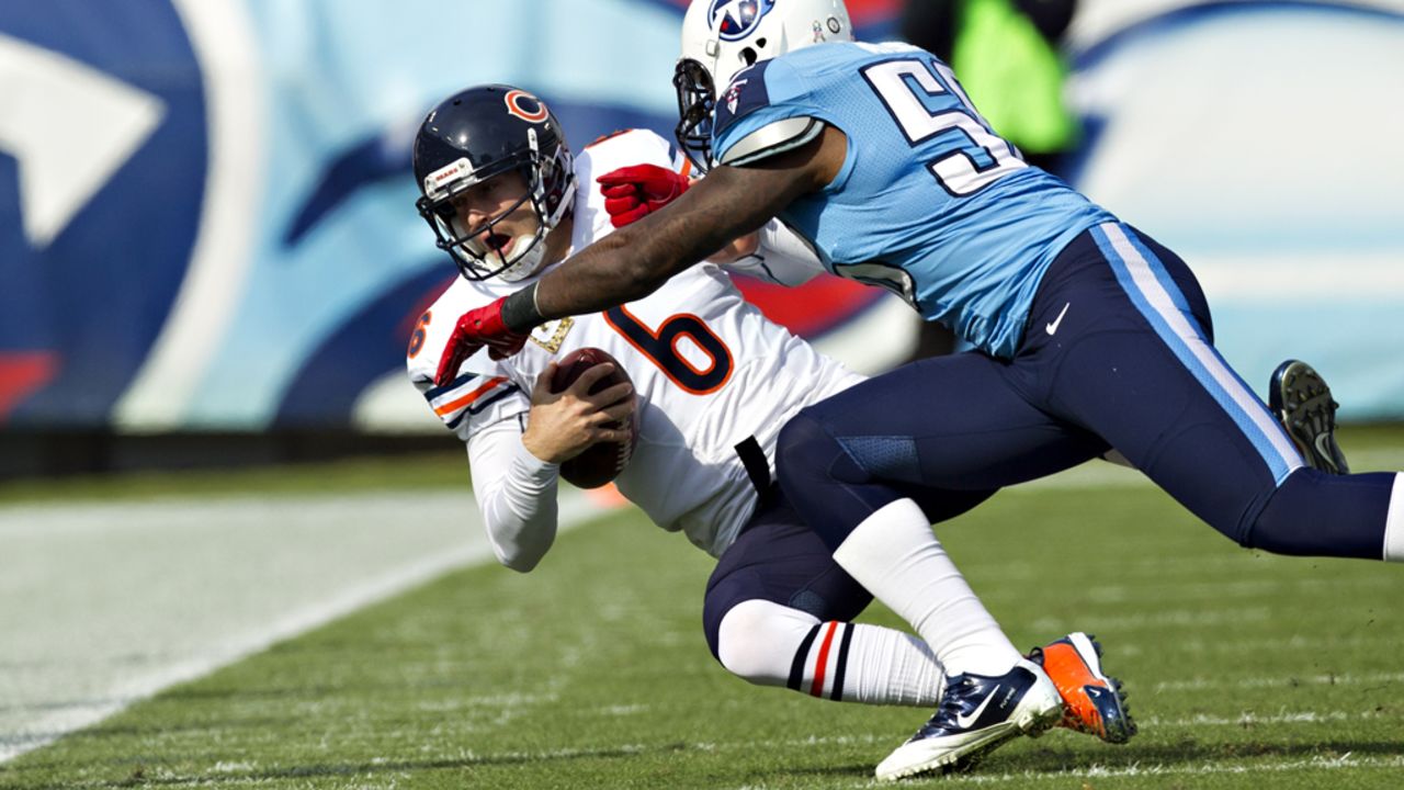 Jay Cutler of the Bears is tackled by Akeem Ayers of the Titans on Sunday.