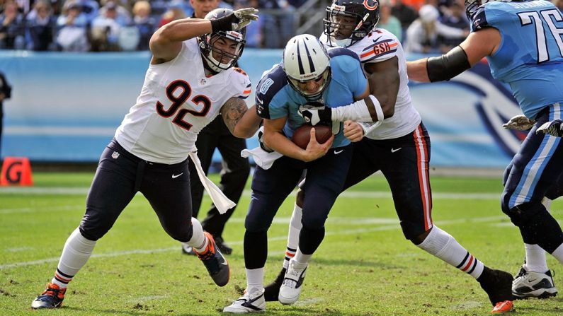 Matt Hasselbeck is sacked by Israel Idonije and Stephen Paea of the Bears on Sunday.