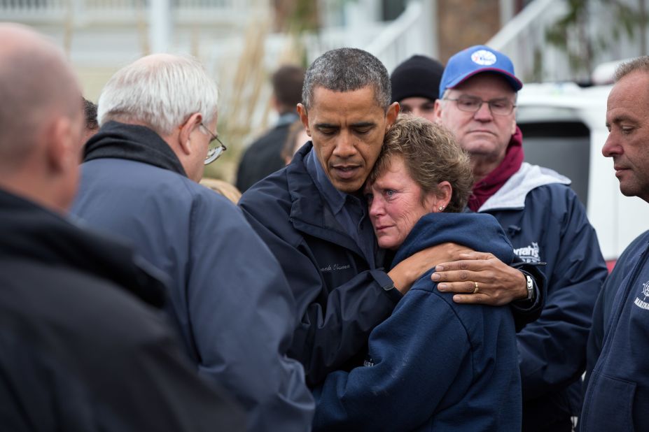 Obama hugs Donna Vanzant, the owner of North Point Marina, as he tours damage from Hurricane Sandy in Brigantine, New Jersey, on Oct. 31, 2012.