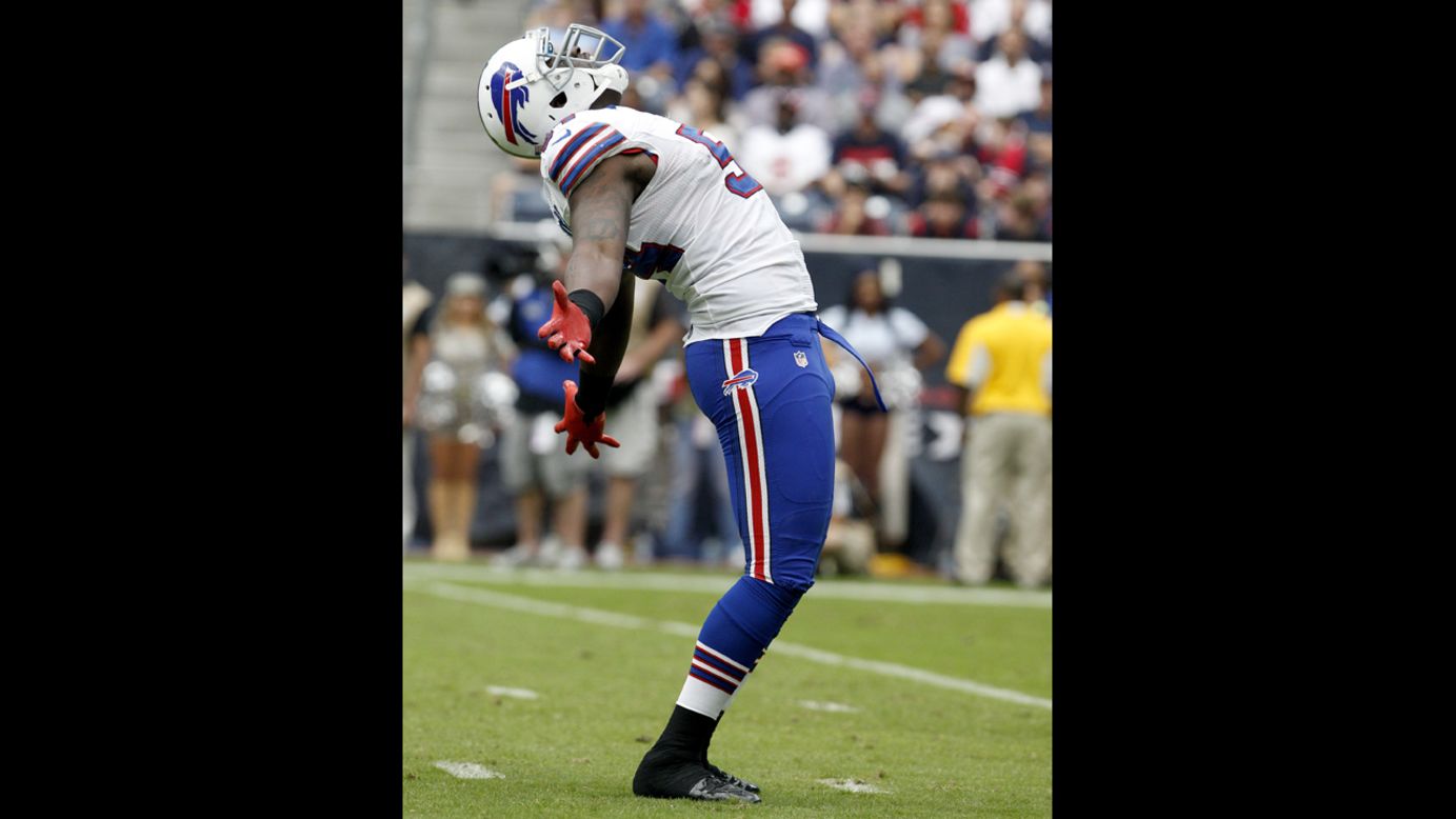 Bills defensive end Kyle Moore celebrates after sacking Texans quarterback Matt Schaub.