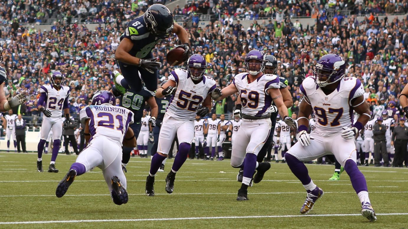 Wide receiver Golden Tate of the Seahawks scores a touchdown against the Vikings on Sunday.