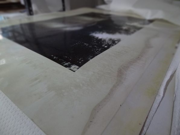 A photograph dries at Derek Eller Gallery after being damaged by Sandy flooding.