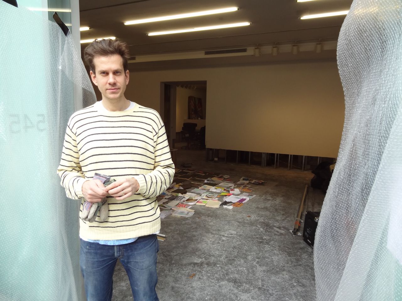 Gallery owner Leo Koenig stands outside his space during repairs.