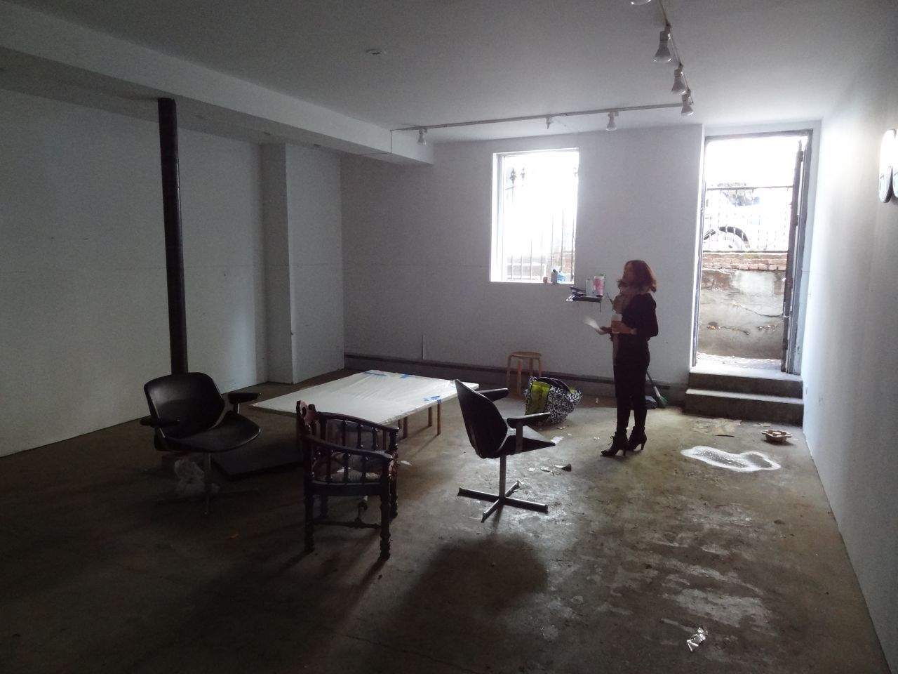 Marisa Newman assesses the flood damage at the Newman Popiashvili Gallery.