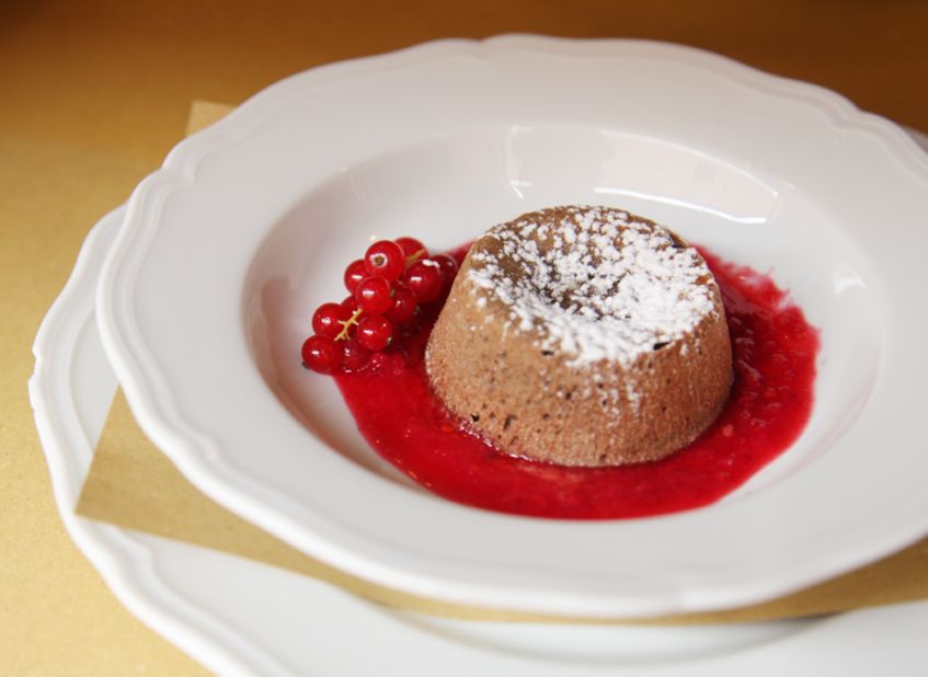 Molten chocolate cake with red currants provides a fitting feast's end.