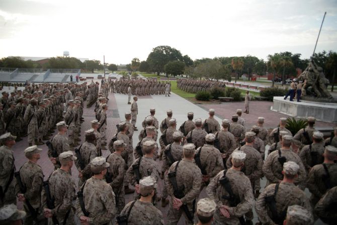 Recruits of Bravo Company, 1st Recruit Training Battalion, gather at Parris Island's Iwo Jima statue to receive their Eagle, Globe and Anchors last August. Each drill instructor presents their recruits with a small eagle globe and anchor emblem, shakes their hands, calls them Marines for the first time and tells them, "job well done."