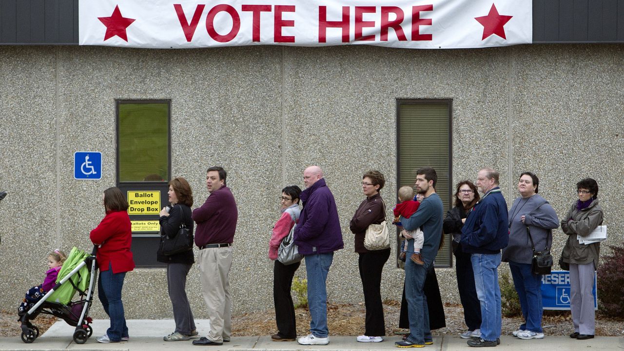 Voters line up outside the Johnson County election office in Olathe, Kansas, in the 2012 November elections.