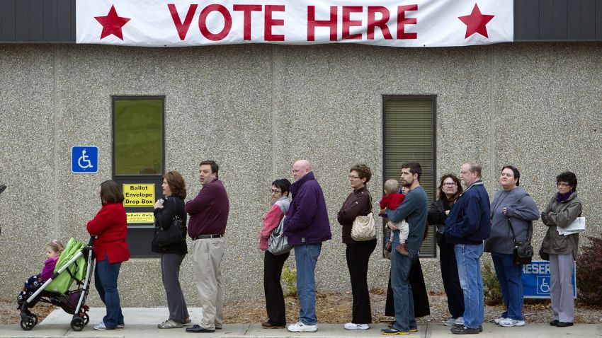 Voters line up outside the Johnson County election office in Olathe, Kansas, on Monday, November 5, the last day of early voting.