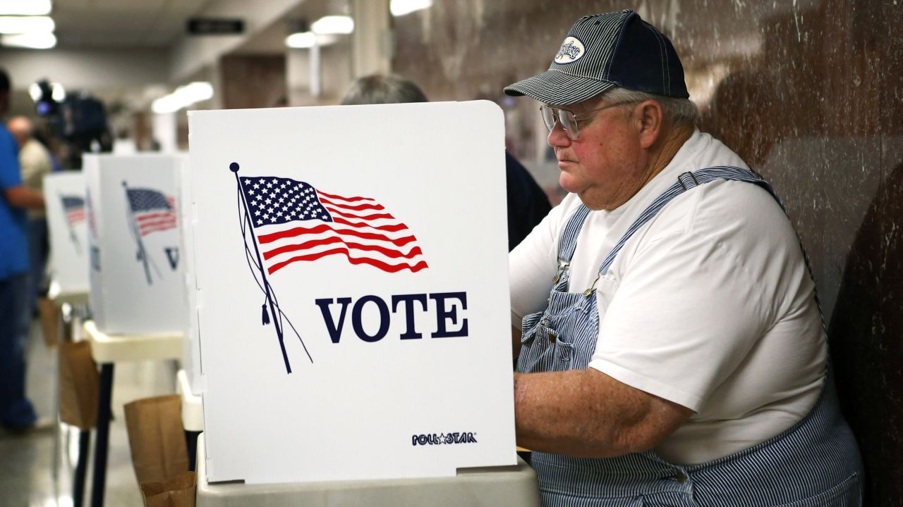 Jerry Nagel fills in his ballot during early voting at the Black Hawk County Courthouse in Waterloo, Iowa, on September 27, the first day of early voting in the state.