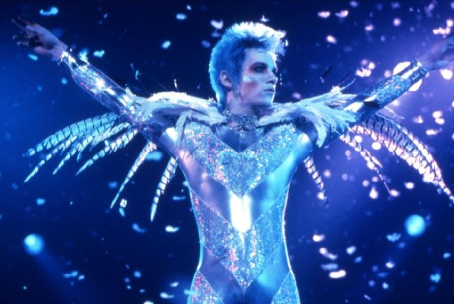 In 1998's "Velvet Goldmine," Christian Bale plays Arthur Stuartwan, a journalist investigating the disappearance of former rock star Brian Slade, played by Jonathan Rhys Meyers. Ewan McGregor also stars as Slade's one-time lover, Curt Wild.