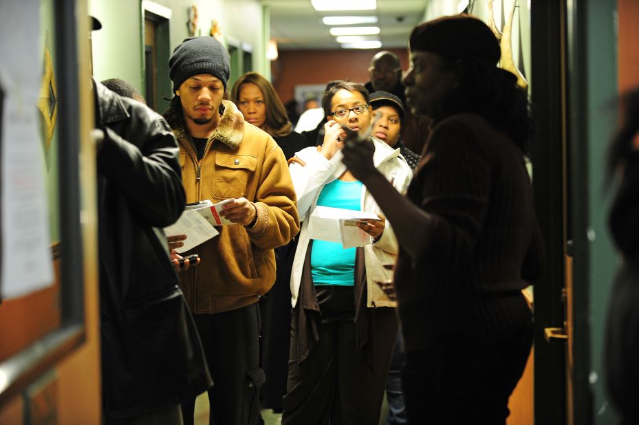 Citizens wait in line at a polling station in a senior appartment complex in Chicago.  