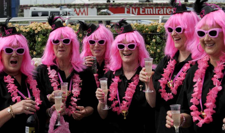 These racegoers toast the day ahead of the main race. Ten races are being run throughout the day, over varying distances. 