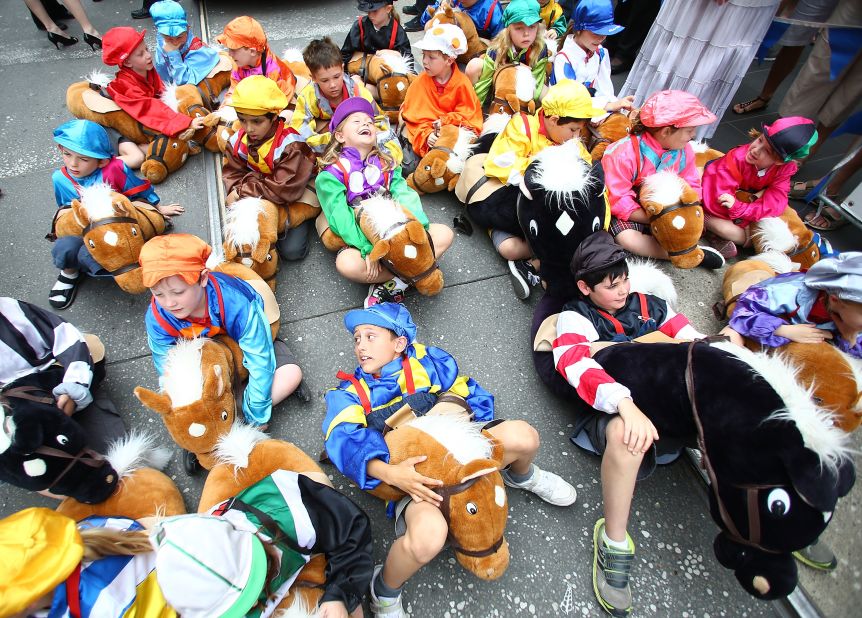 Children dressed as jockeys take a break before the parade starts on November 5, 2012 in Melbourne, Australia. 