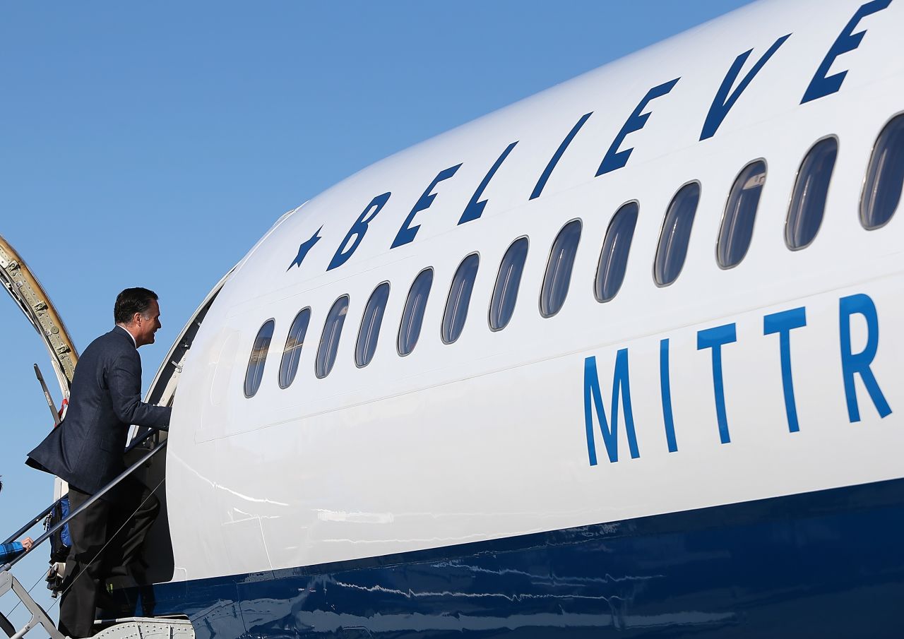 Romney boards his campaign plane in Bedford, Massachusetts. The Romney camp has decided to continue campaigning on Election Day.
