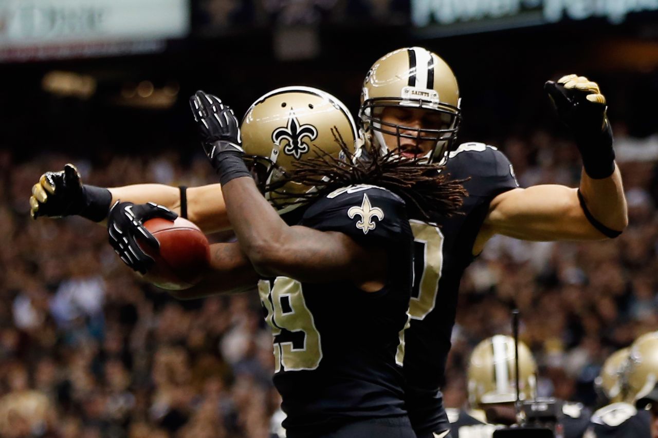 Chris Ivory, left, and  Jimmy Graham of the Saints celebrate after Ivory scored a touchdown against the Eagles on Monday.