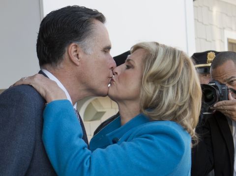 Mitt Romney and his wife, Ann, kiss after casting their votes in Belmont, Massachusetts.