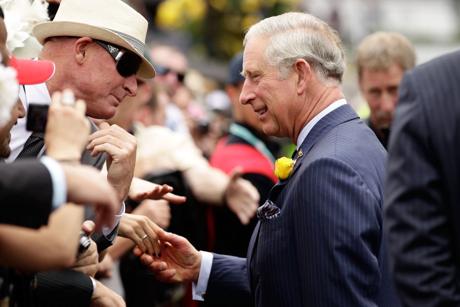 Prince Charles, Prince of Wales greets a racegoer on Melbourne Cup Day at Flemington Racecourse on November 6, 2012.