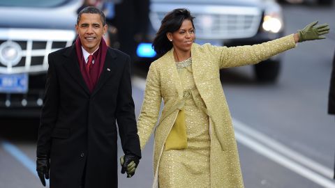 President Barack Obama and first lady Michelle Obama walk in the 2009 inaugural parade.