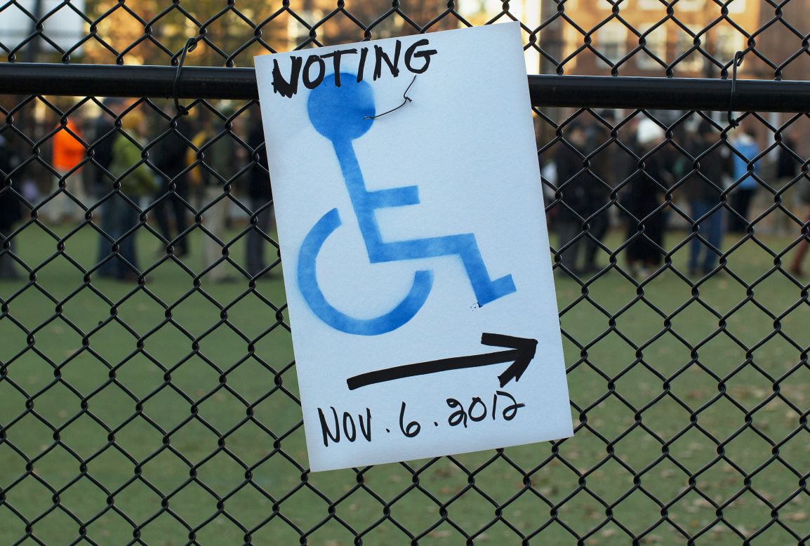 A sign directs disabled voters to a polling site entrance at the Graham & Parks School in Cambridge, Massachusetts.