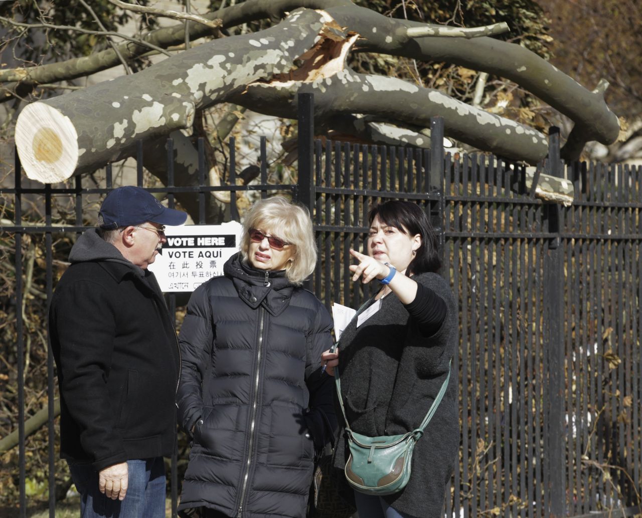 A poll worker directs people to a temporary polling center in the Coney Island section of Brooklyn, New York. Polling sites in Coney Island and the surrounding area were damaged during Superstorm Sandy.