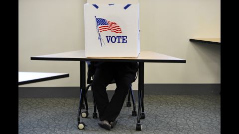 A person votes at George Mason University in Fairfax, Virginia.