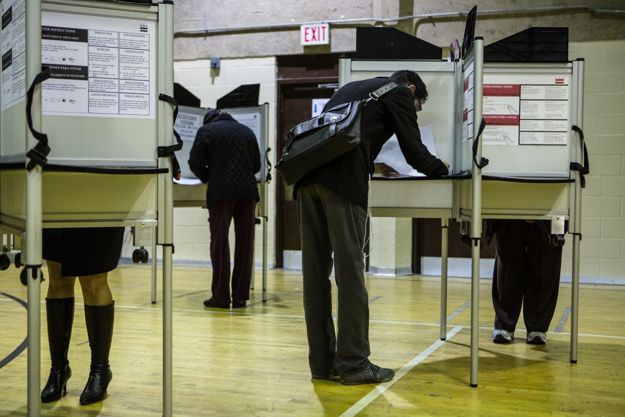 Voters cast their ballots at Dunbar High School in Washington, D.C.